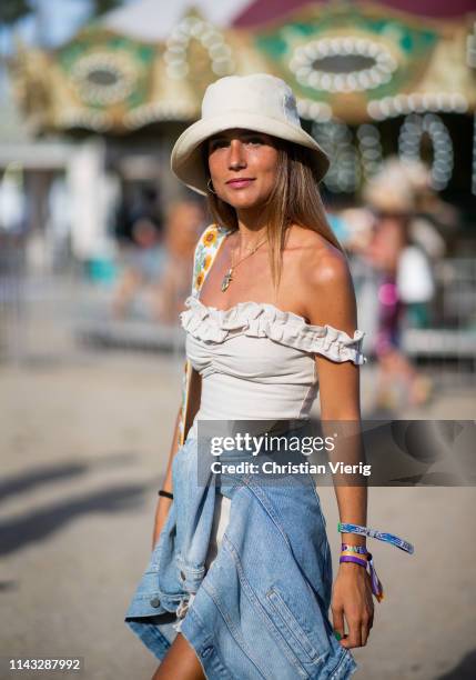 Belen Hostalet is seen wearing bucket hat, off shoulder dress at the Revolve Festival during Coachella Festival on April 14, 2019 in La Quinta,...
