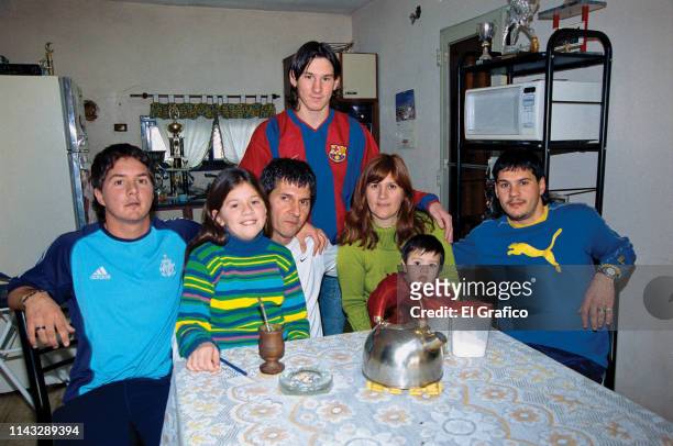 Lionel Messi poses with his brother Rodrigo , sister María Sol, father Jorge, mother Celia, nephew Tomás and brother Matías during a private photo...