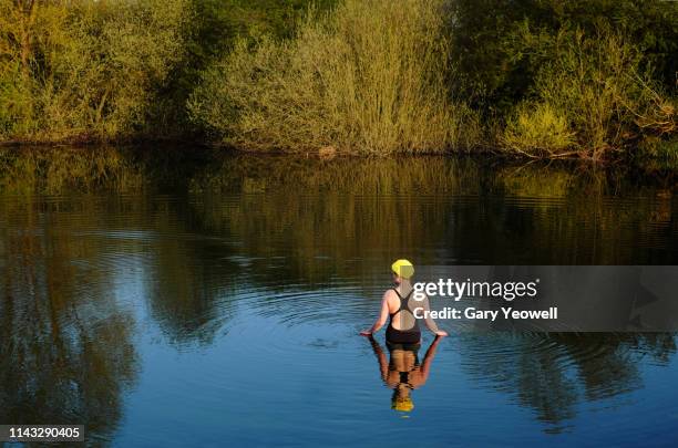 female open water swimmer in a lake - open water swimming stock pictures, royalty-free photos & images