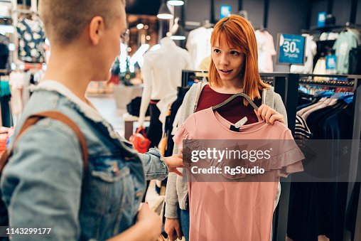 Teenage girls buying summer clothes Teenage girls buying summer clothes