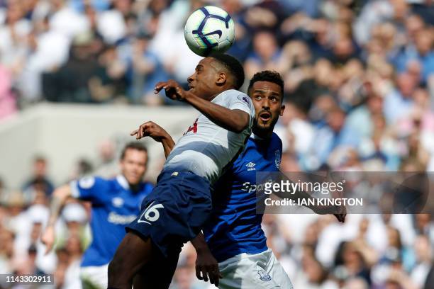 Tottenham Hotspur's English defender Kyle Walker-Peters vies with Everton's English striker Theo Walcott during the English Premier League football...