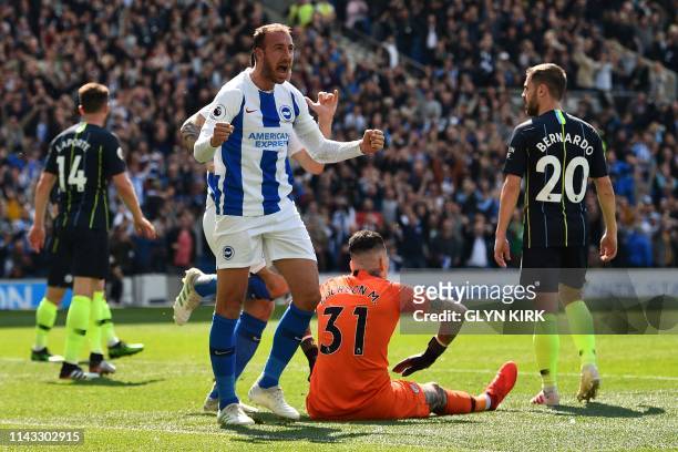 Brighton's English striker Glenn Murray celebrates scoring the opening goal during the English Premier League football match between Brighton and...