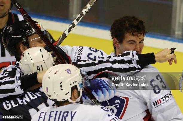 Alexandre Texier of France fights with Luke Glendening of USA during the 2019 IIHF Ice Hockey World Championship Slovakia group A game between United...