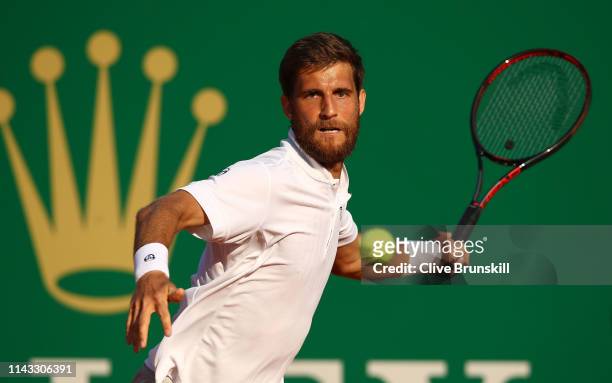 Martin Klizan of Slovakia plays a forehand against Dominic Thiem of Austria in their second round match during day four of the Rolex Monte-Carlo...