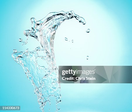 Big crest splash of clean water on blue Big crest splash of clean water on blue