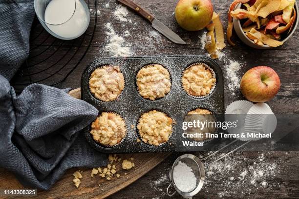 top view of ingredients for apple muffins on a wooden background. - kitchen bench from above stock-fotos und bilder