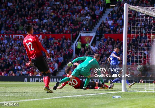 Nathaniel Mendez-Laing scores the second goal for Cardiff City FC during the Premier League match between Manchester United and Cardiff City at Old...