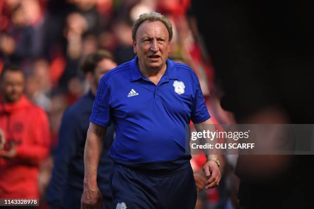 Cardiff City's English manager Neil Warnock leaves after the English Premier League football match between Manchester United and Cardiff City at Old...