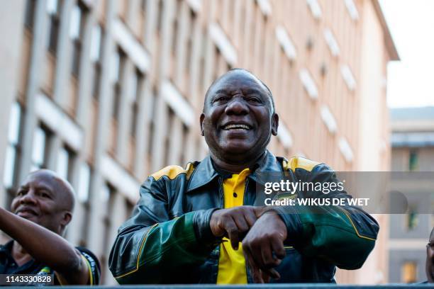 President Elect of South Africa and President of the African National Congress Cyril Ramaphosa gestures as he dances on stage after delivering a...