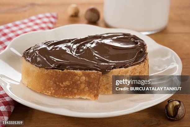 chocolate spread on bread - nutella stock pictures, royalty-free photos & images