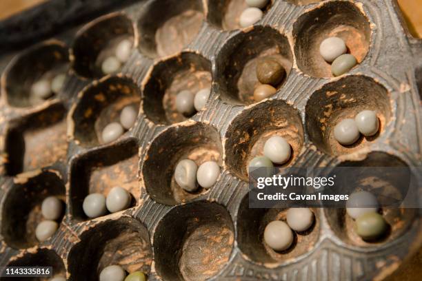 high angle view of oware game - mancala stockfoto's en -beelden