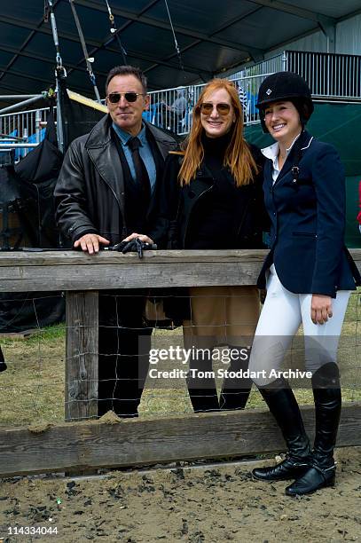 American rock singer Bruce Springsteen and his wife Patti Scialfa, photographed with their daughter Jessica Springsteen after she won her jumping...