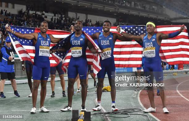 Men's 4x100 metres relay team members Isiah Young, Justin Gatlin, Noah Lyles, and Michael Rodgers pose for photographers after the men's 4x100 metres...