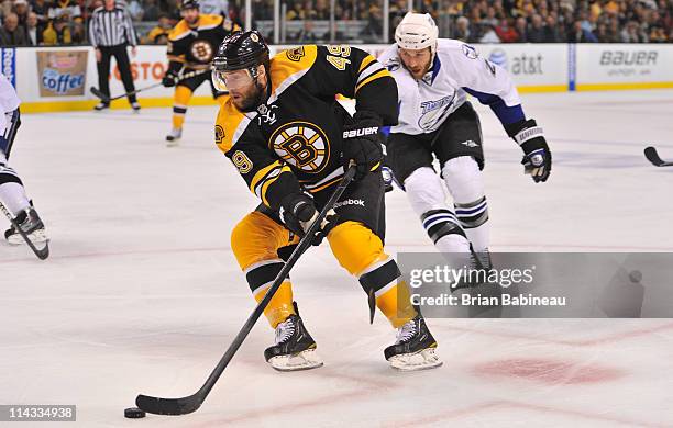 Rich Peverley of the Boston Bruins skates with the puck against the Tampa Bay Lightning in Game Two of the Eastern Conference Finals during the 2011...