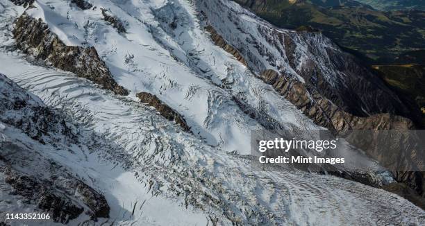 snowy glaciers in mountains, chamonix, france - aiguille du midi stock-fotos und bilder