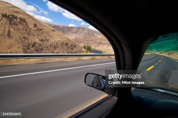 Car Driving On Road Through Yakima River Canyon Washington United States High-Res Stock Photo