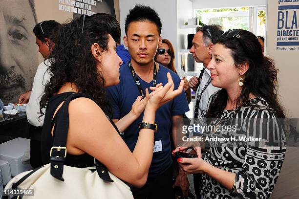 Hania Mroue speaks with guests during the "DFI - Gathering of International Film Institutes" during the 64th Annual Cannes Film Festival at Palais...