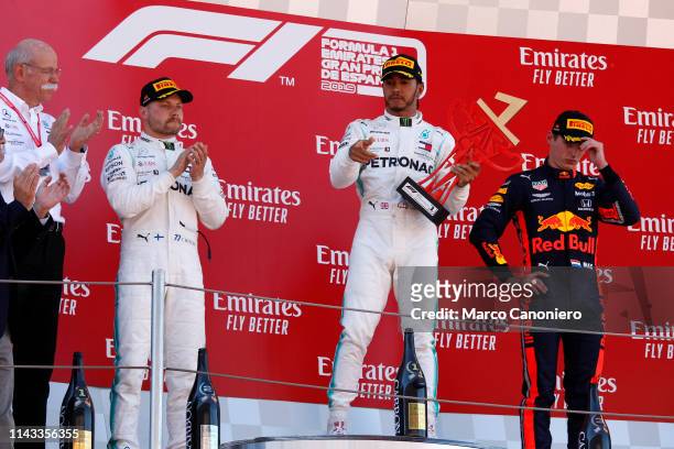 Top three finishers Lewis Hamilton of Great Britain and Mercedes GP, Valtteri Bottas of Finland and Mercedes GP and Max Verstappen of Netherlands and...