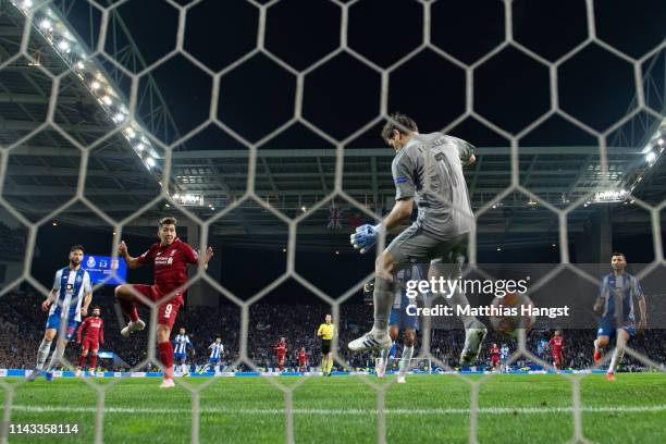 Roberto Firmino of Liverpool scores his team's third goal past Iker Casillas of FC Porto during the UEFA Champions League Quarter Final second leg...