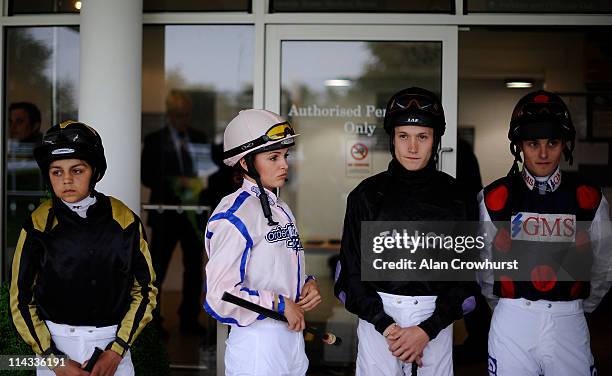 Apprentice jockeys Bradley Bosley, Leonna Mayor, Toby Atkinson and Ryan Clark, look on at Goodwood racecourse on May 18, 2011 in Chichester, England