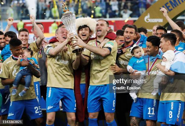 Zenit Saint Petersburg players celebrate with the trophy after the Russian Premier League match between FC Zenit Saint Petersburg and PFC CSKA Moscow...