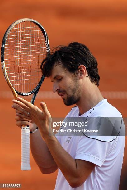 Philipp Petzschner of Germany looks dejected during the match between Philipp Petzschner and Christopher Kas and Marcel Granollers and Marc Lopez of...