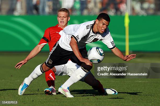 Shawn Parker of Germany battles for the ball with Christoph Martschinko of Austria during the International friendly match between the U 18 teams of...