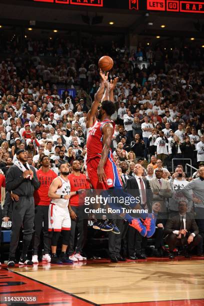 Joel Embiid of the Philadelphia 76ers blocks as Kawhi Leonard of the Toronto Raptors shoots the game-winning three-point basket in Game Seven of the...