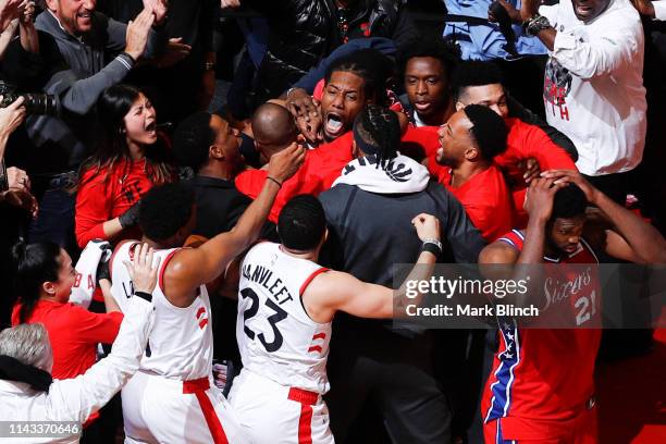 Kawhi Leonard of the Toronto Raptors reacts to hitting the game winning shot against the Philadelphia 76ers during Game Seven of the Eastern...