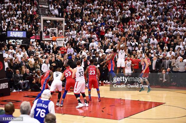 Kawhi Leonard of the Toronto Raptors shoots the game winning basket against the Philadelphia 76ers during Game Seven of the Eastern Conference...