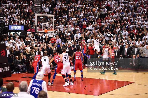 Kawhi Leonard of the Toronto Raptors shoots the game winning basket against the Philadelphia 76ers during Game Seven of the Eastern Conference...