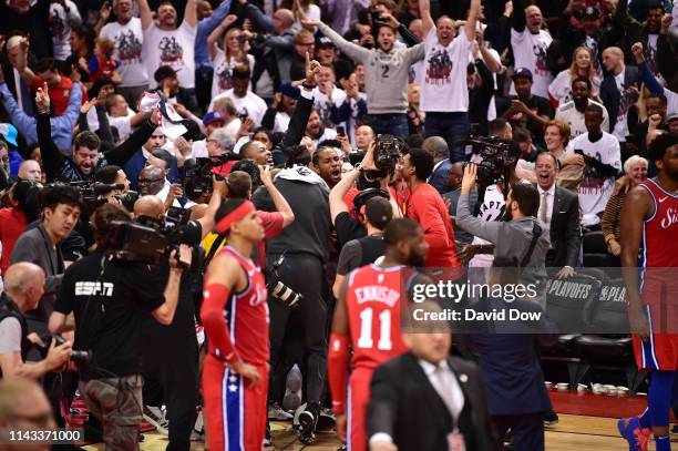Kawhi Leonard of the Toronto Raptors reacts after shooting the game winning basket against the Philadelphia 76ers during Game Seven of the Eastern...