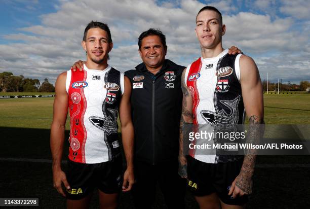 Ben Long, Nicky Winmar and Matthew Parker pose for a photograph during a St Kilda Saints media opportunity announcing details around their...