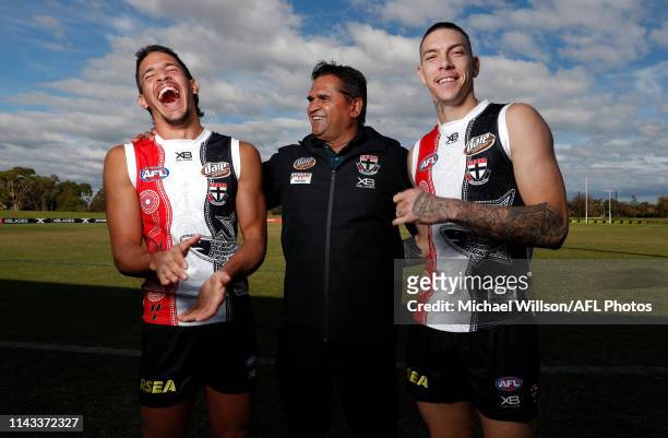 Ben Long, Nicky Winmar and Matthew Parker pose for a photograph during a St Kilda Saints media opportunity announcing details around their...