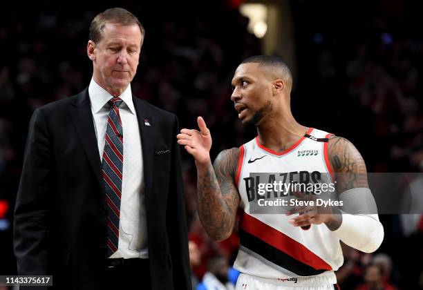 Damian Lillard of the Portland Trail Blazers speaks with Terry Stotts in the second half of Game One of the Western Conference quarterfinals against...