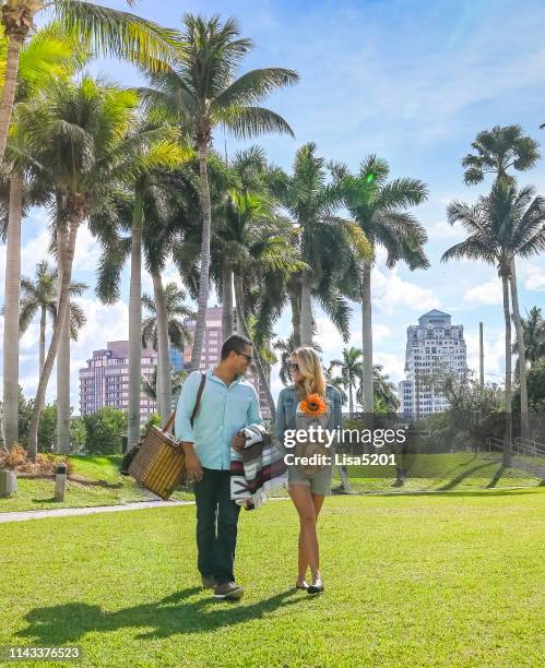 picnic couple perfect day in the tropics - west palm beach florida stock pictures, royalty-free photos & images