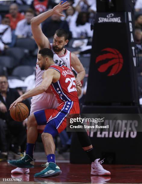 Toronto Raptors center Marc Gasol defends against Philadelphia 76ers guard Ben Simmons as the Toronto Raptors beat the Philadelphia 76ers 92-90 in...