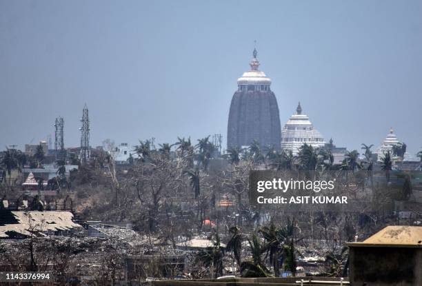 This photo taken on May 12, 2019 shows the Lord Jagannath temple amid destroyed trees and debris in Puri in the eastern Indian state of Odisha,...