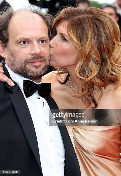 Actress Florence Pernel kisses actor Denis Podalydes as they attend the "La Conquete" Premiere during the 64th Annual Cannes Film Festival at the...