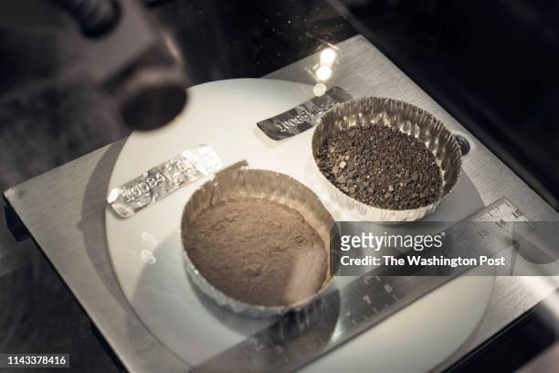 Lunar rock samples collected at the end of the Apollo 11 mission by Neil Armstrong are seen at the Lyndon B. Johnson Space Center in Houston, Texas...
