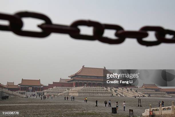 Tourists leave the Forbidden City, which was the Chinese imperial palace from the mid-Ming Dynasty to the end of the Qing Dynasty, on May 18, 2011 in...