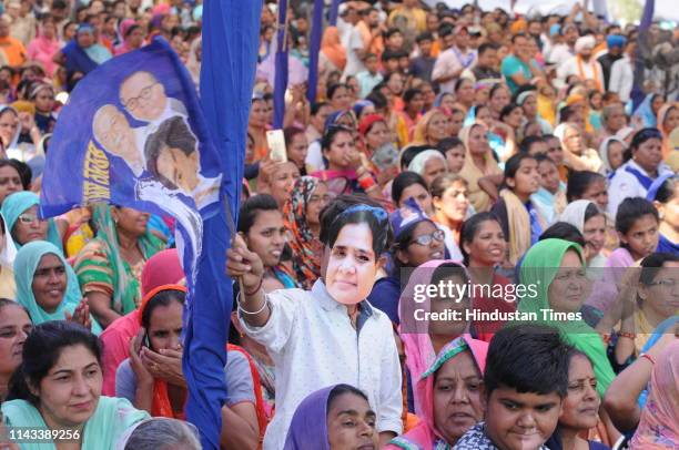Supporter wearing mask of BSP supremo Mayawati during political Rally of Punjab Democratic Alliance near SBS Nagar on May 12, 2019 in Jalandhar,...