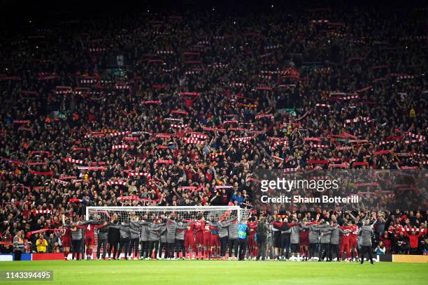 Liverpool players celebrate with fans after the UEFA Champions League Semi Final second leg match between Liverpool and Barcelona at Anfield on May...