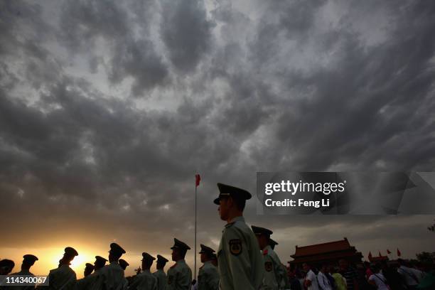 Paramilitary policemen patrol at the Tiananmen Square outside the Forbidden City, which was the Chinese imperial palace from the mid-Ming Dynasty to...