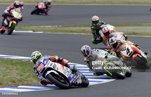 Japanese 250cc rider Daijiro Kato of Axo Honda Gresini leads a pack during the 250cc final of the world motorcycle championships Pacific Grand Prix...