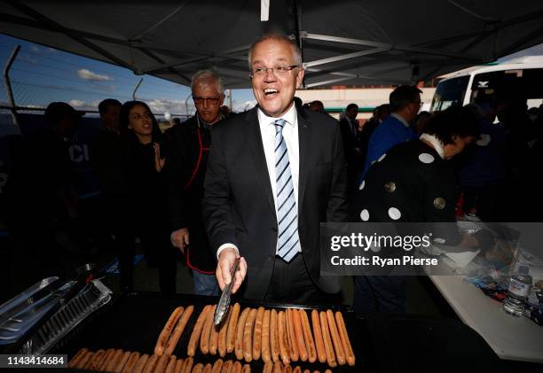 Scott Morrison, Prime Minister of Australia, cooks sausages during a Liberal Party Campaign Rally at Launceston Airport on April 18, 2019 in...