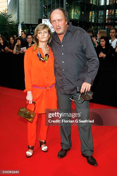 Actor Hans Werner Olm and girlfriend Cornelia Utz attend the 'Grand Opening Cinema Berlin' with the screening of 'Pirates Of The Caribbean: On...