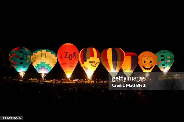 Hot air balloons are seen during the Hunter Valley Night Glow at Roche Estate vineyards on April 13, 2019 in Pokolbin, Australia.