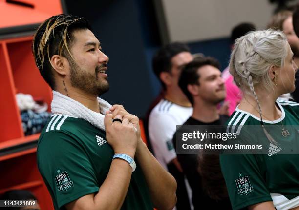 S Wax Motif watches as his team competes during the Copa Del Rave Charity Soccer Tournament at Evolve Project LA on April 17, 2019 in Los Angeles,...