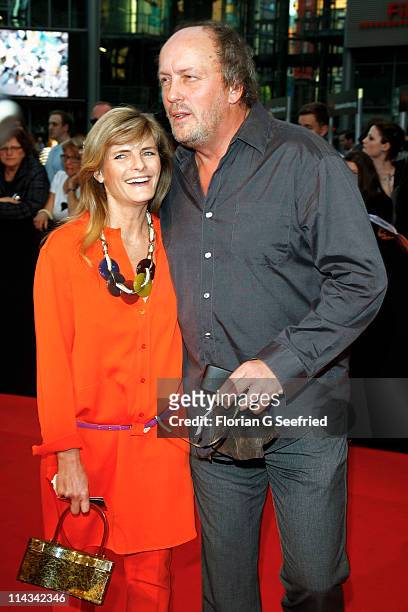 Actor Hans Werner Olm and girlfriend Cornelia Utz attend the 'Grand Opening Cinema Berlin' with the screening of 'Pirates Of The Caribbean: On...